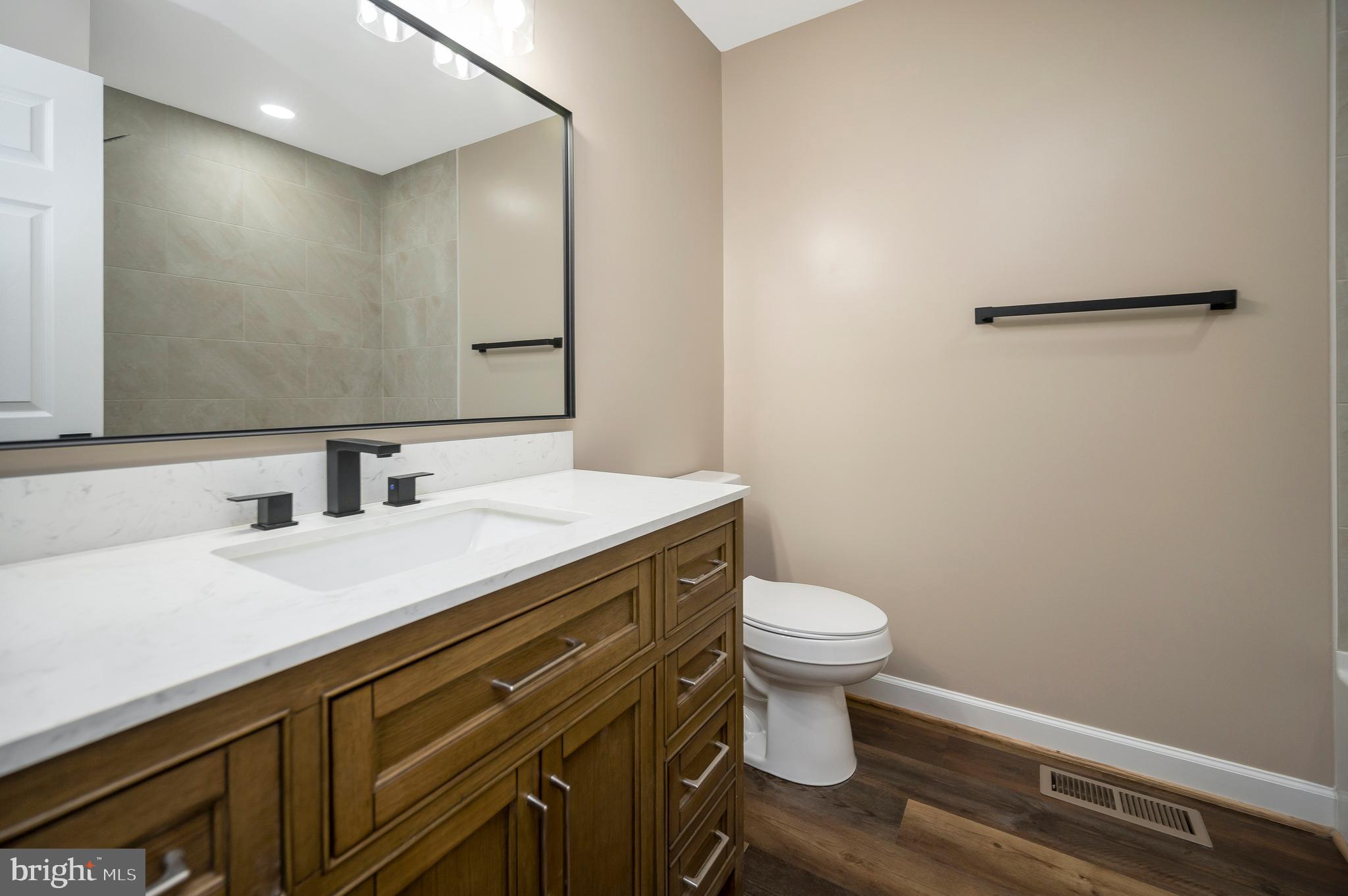 13452 Post Oak Road Spotsylvania, VA 22551 - Photo 37 of 56 a bathroom with a sink and a toilet
