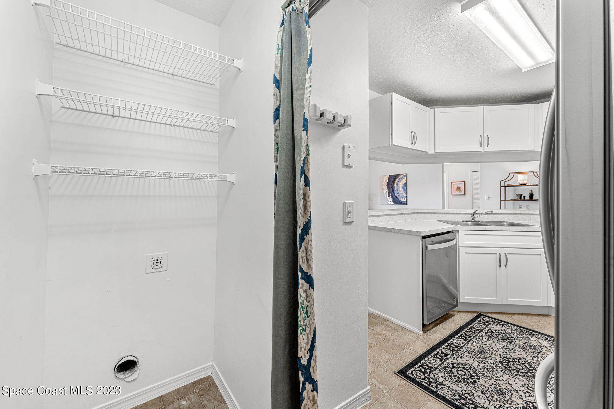 7667 North Wickham Road, Unit 1409 Melbourne, FL 32940 - Photo 13 of 32 Laundry off of Kitchen