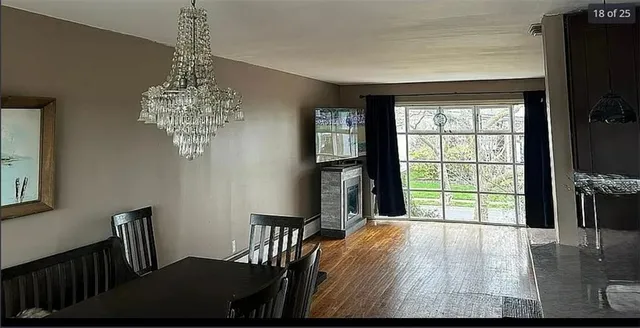 a bed room with a bed window and mirror