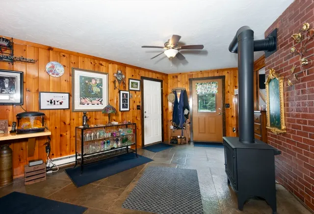 a bedroom with furniture and large window