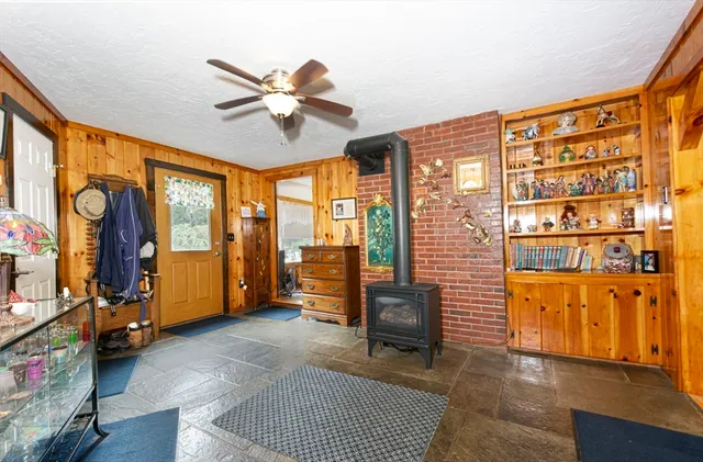 a view of an entryway with wooden floor and windows