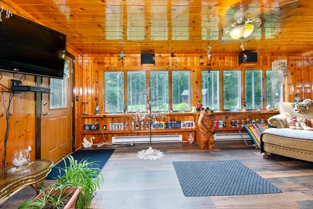 a outdoor space with patio furniture and a flat screen tv