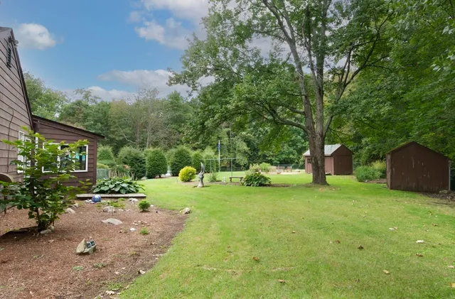 a view of a tree in front of a house