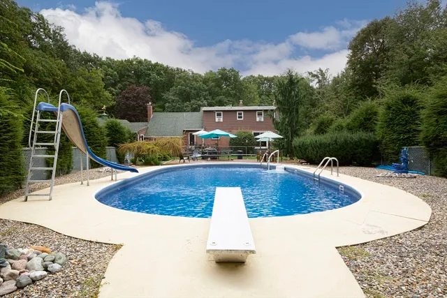 a view of a swimming pool with a patio