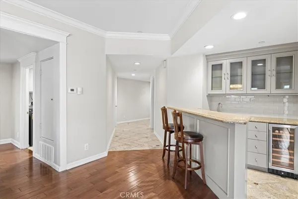 a view of kitchen with furniture and wooden floor