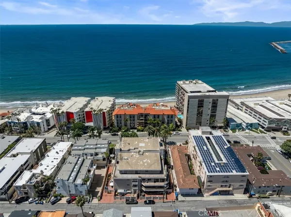 an aerial view of a building with garden