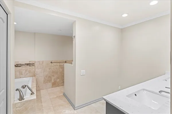 a bathroom with a shower and a sink