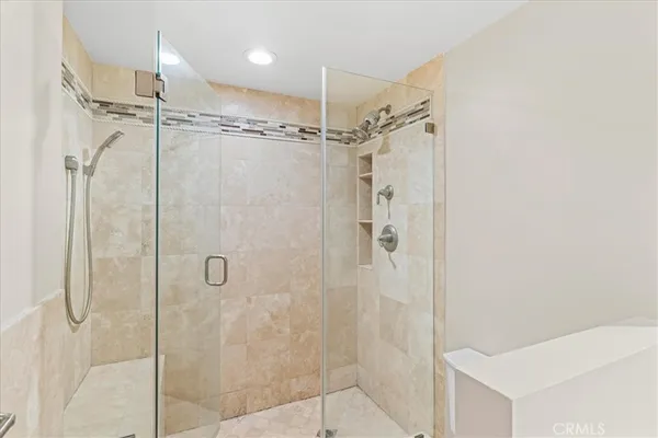 a bathroom with a sink double vanity and a tub