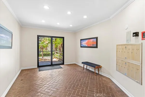 a living room with furniture a piano and a large window