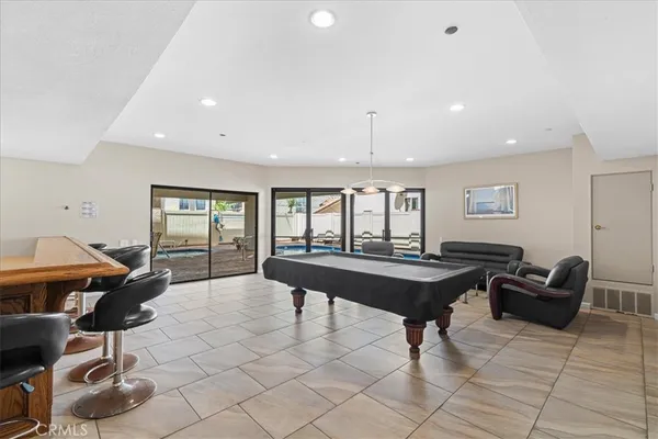 a living room with lots of furniture and a table