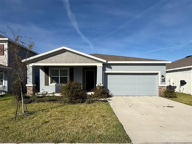front view of a house with potted plants