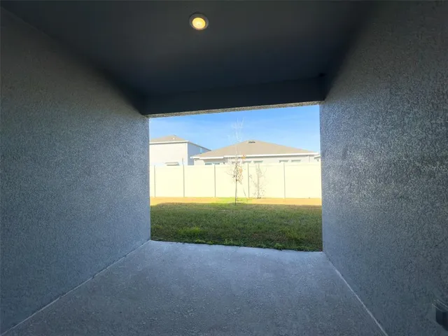 a view of a big room with windows