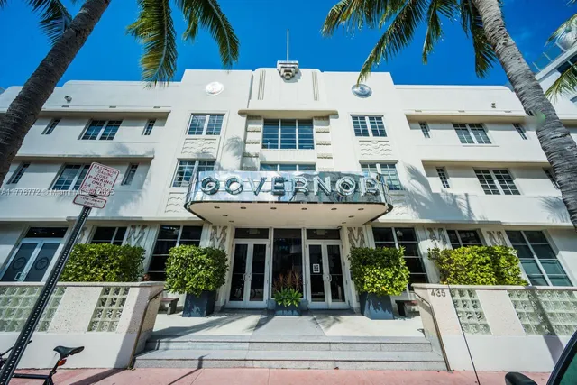 a front view of building with yard