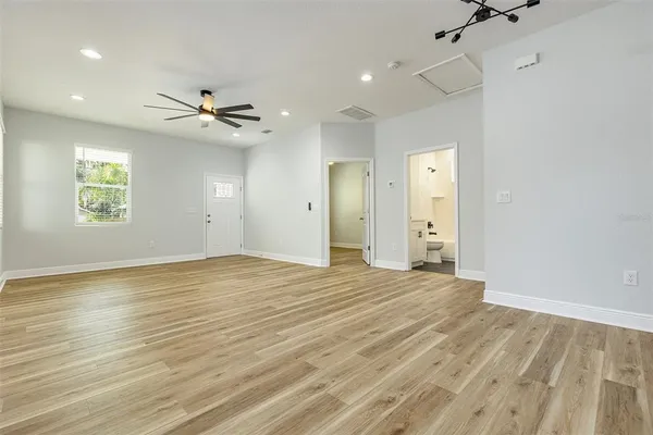 a view of an empty room with a window