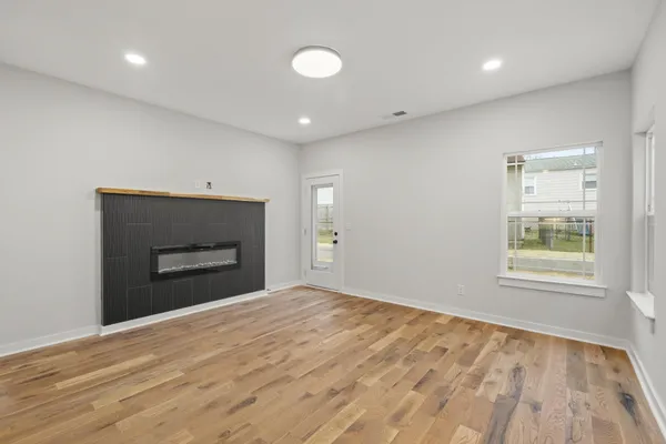 a view of kitchen with kitchen island sink and refrigerator