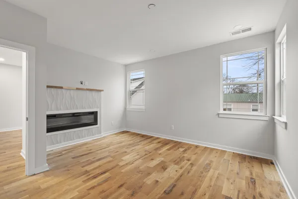 a bathroom with double sink and a mirror