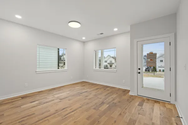 a kitchen with granite countertop a refrigerator sink and stove