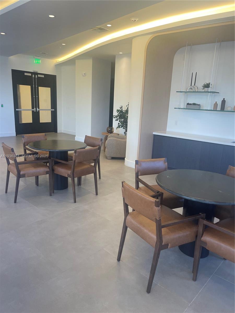 4465 Griffin Road, Unit 1 Hollywood, FL 33314 - Photo 9 of 13 a workspace with furniture