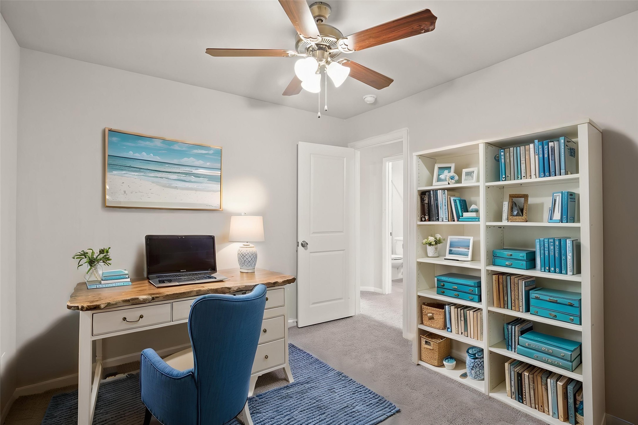 9005 Judwin Street Houston, TX 77075 - Photo 12 of 14 a view of a workspace with furniture and a bookshelf