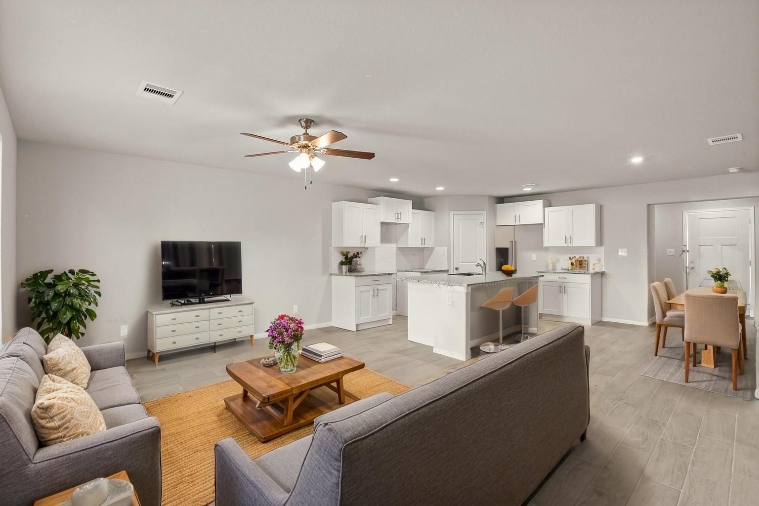 9005 Judwin Street Houston, TX 77075 - Photo 3 of 14 a living room with furniture and a flat screen tv