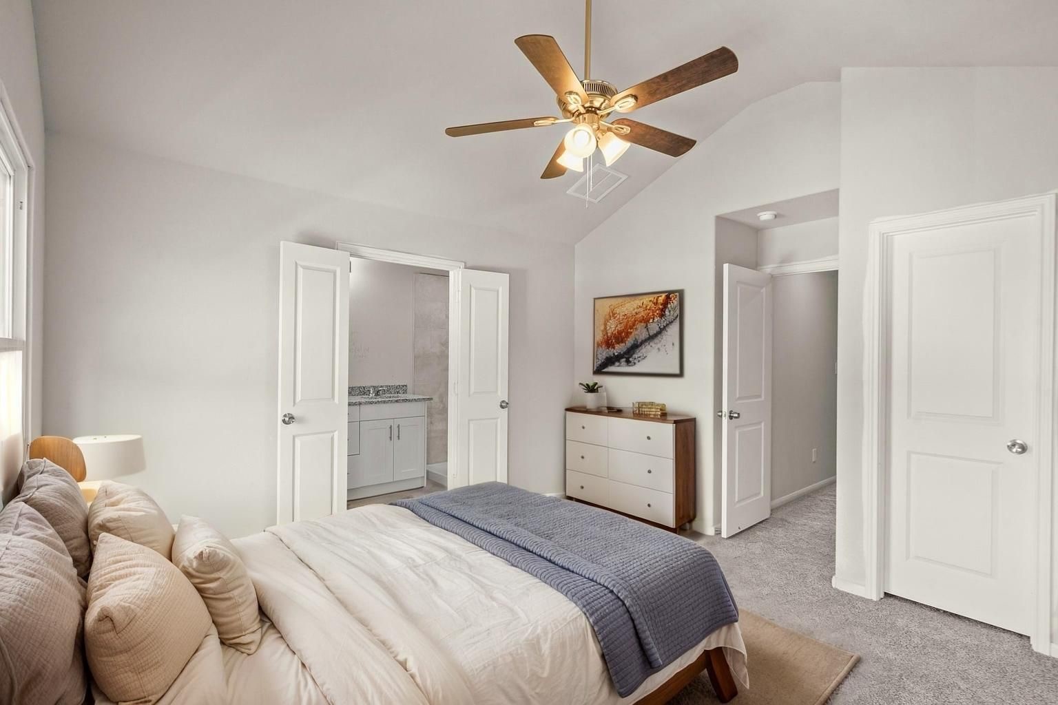 9005 Judwin Street Houston, TX 77075 - Photo 6 of 14 a bedroom with a bed and a chandelier