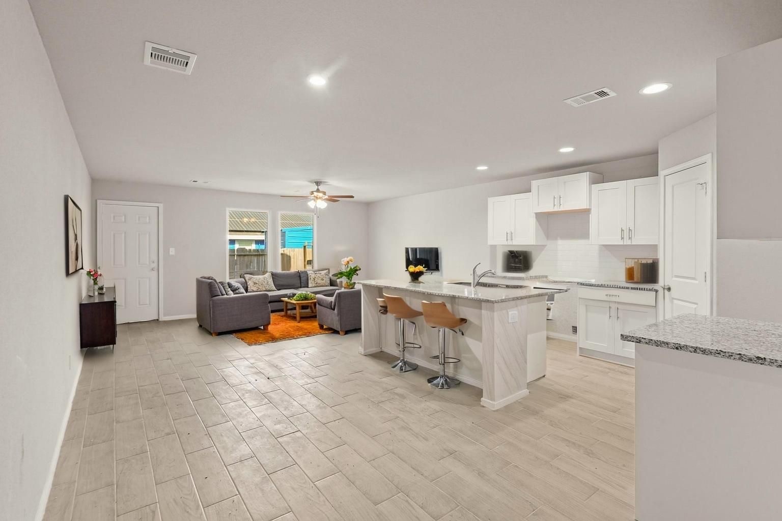 9005 Judwin Street Houston, TX 77075 - Photo 10 of 14 a kitchen with counter top space and living room