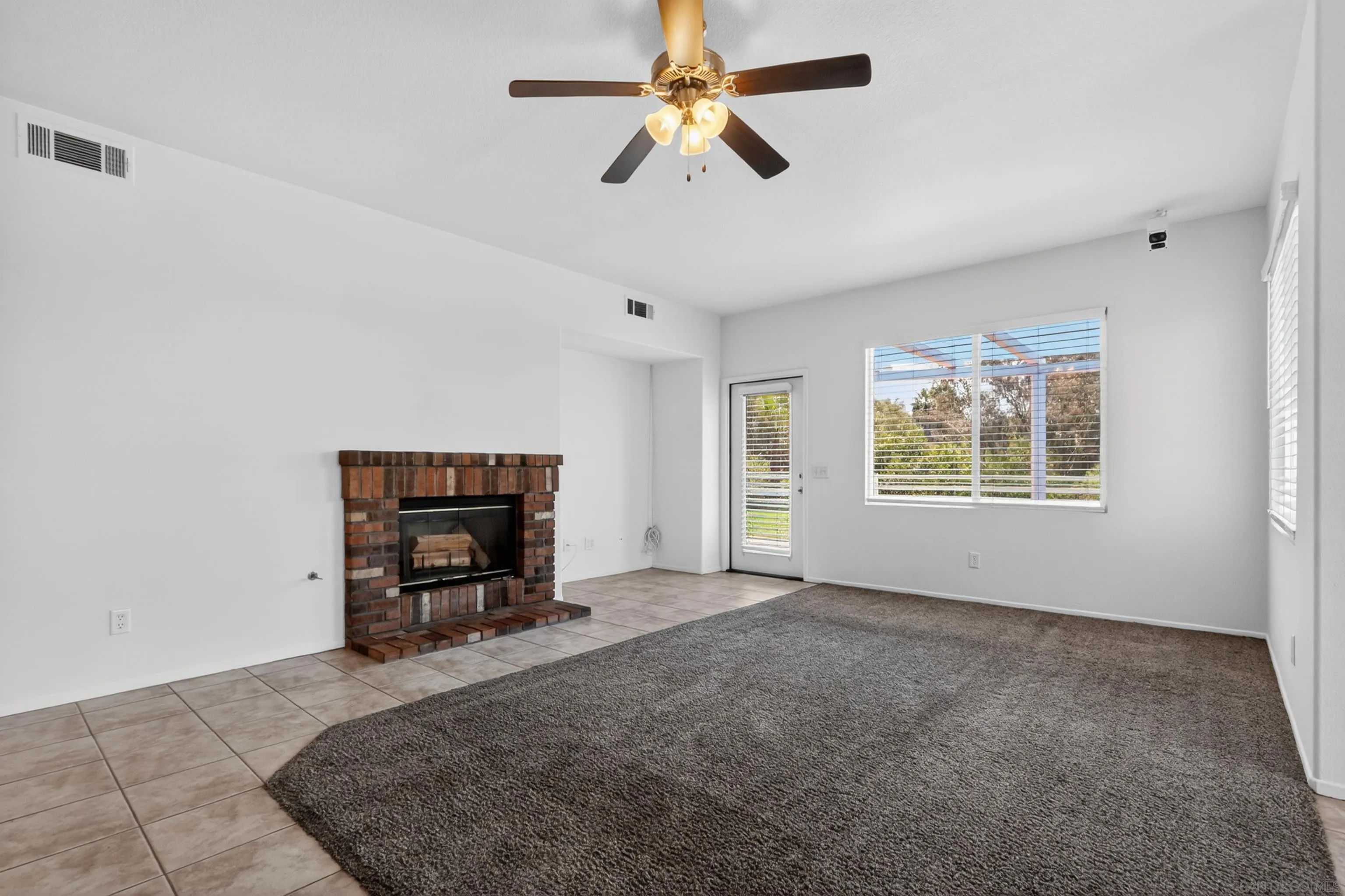 1432 Belmont Park Road Oceanside, CA 92057 - Photo 22 of 54 a living room with furniture and a window