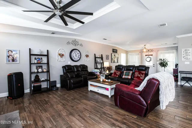 a view of a dining room with furniture window and wooden floor