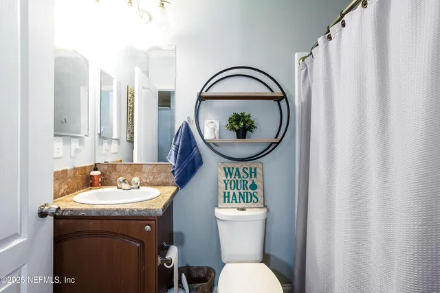 a view of a storage and utility room with washer and dryer