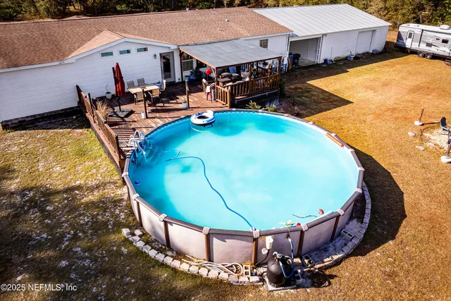 a view of a lake with couches chairs