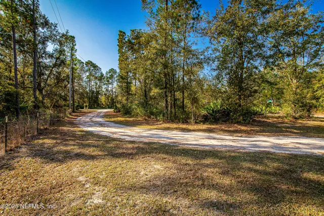 a view of an ocean and yard
