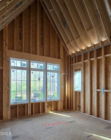 a picture of a room with a bench and a picture of the screen