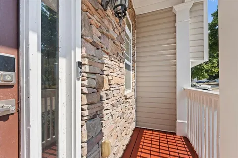 a view of a wooden door and a window