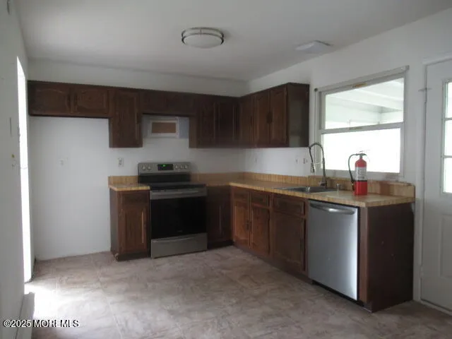 a kitchen with a sink and a stove