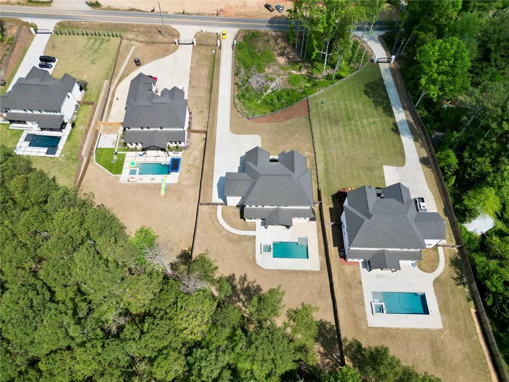 2694 Thompson Mill Road Buford, GA 30519 - Photo 11 of 70 an aerial view of residential house with outdoor space and swimming pool