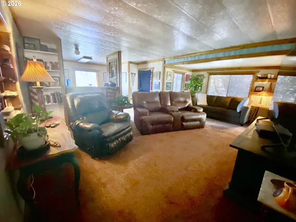 a living room with furniture and a couch