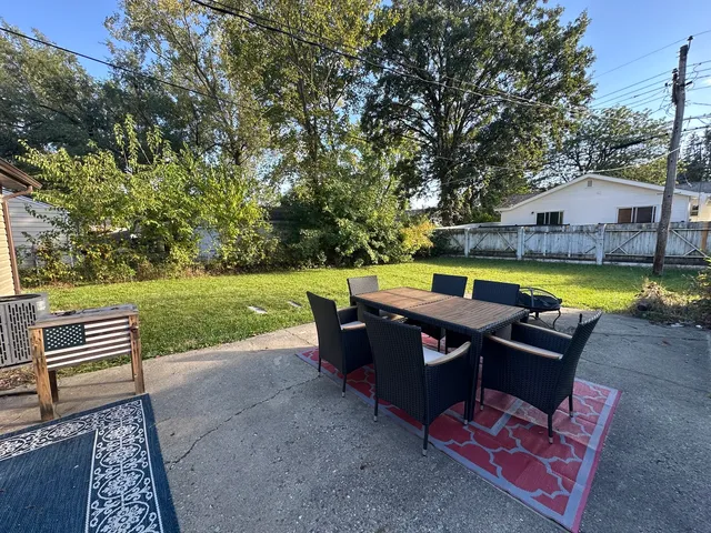 swimming pool with outdoor seating and yard