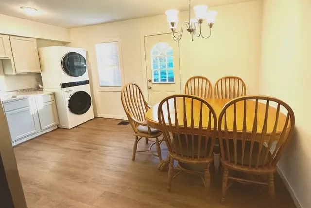 a view of a balcony with table and chairs