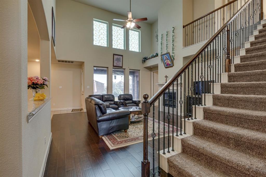336 Red Hill Road Sunnyvale, TX 75182 - Photo 6 of 36 a living room with furniture or stairs and a chandelier