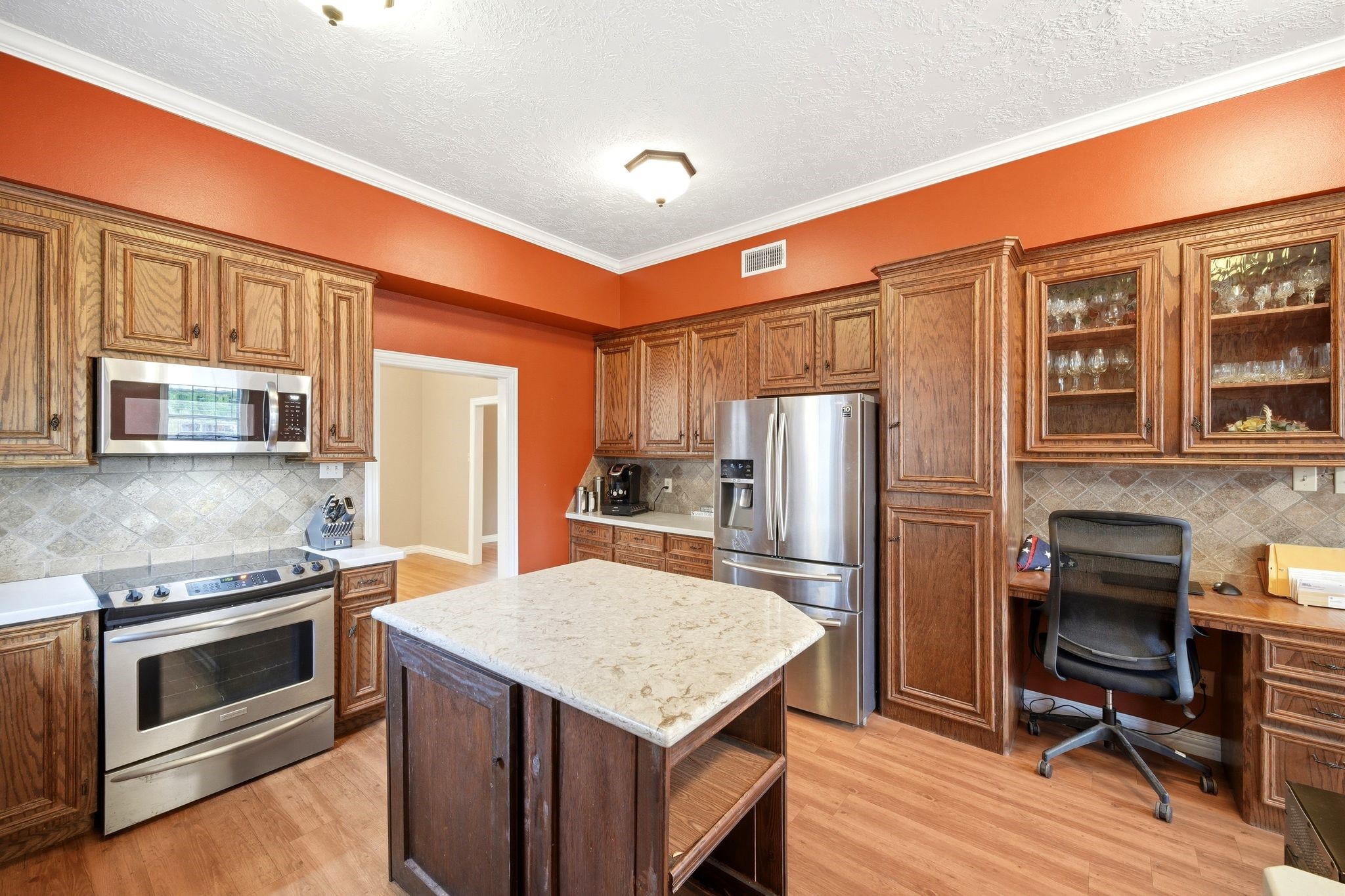 144 Wood Farm Road Huntsville, TX 77320 - Photo 18 of 50 a kitchen with stainless steel appliances granite countertop a refrigerator stove and oven