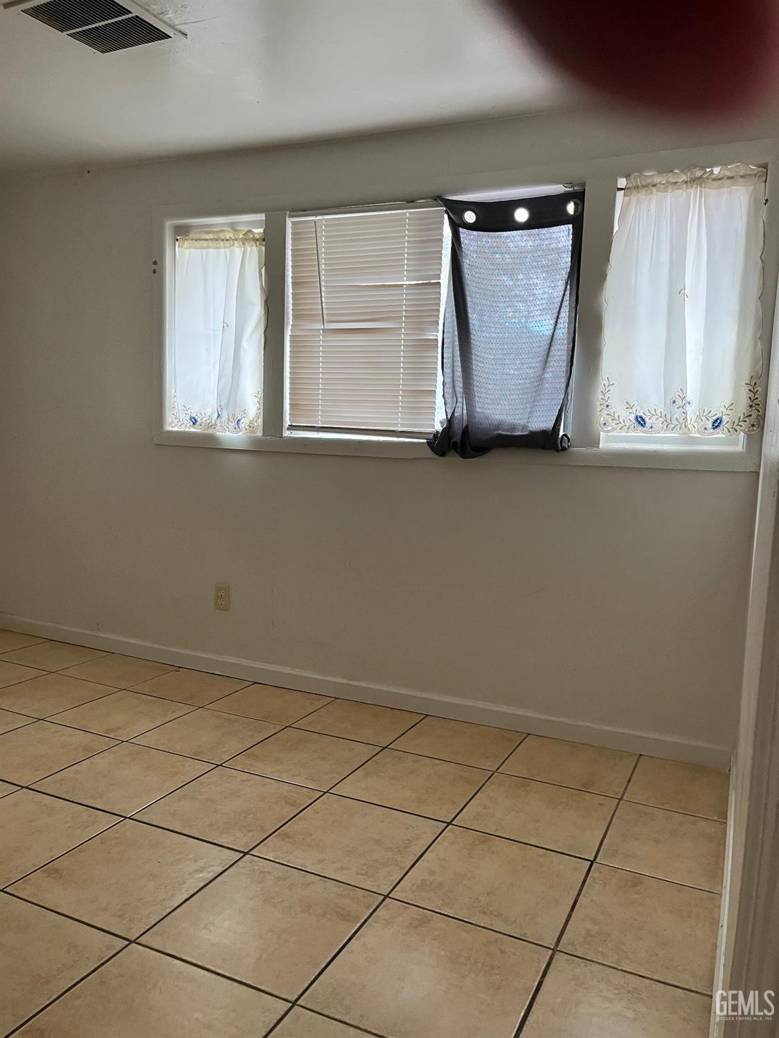 Undisclosed Address Wasco, CA 93280 - Photo 17 of 17 a view of a microwave and window in a room