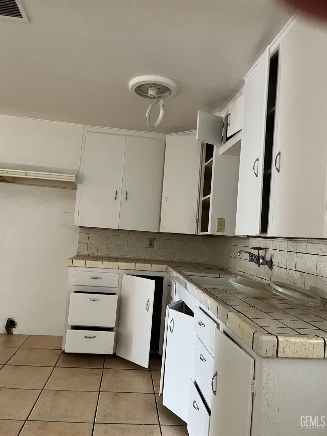 Undisclosed Address Wasco, CA 93280 - Photo 4 of 17 a bathroom with a sink and a mirror