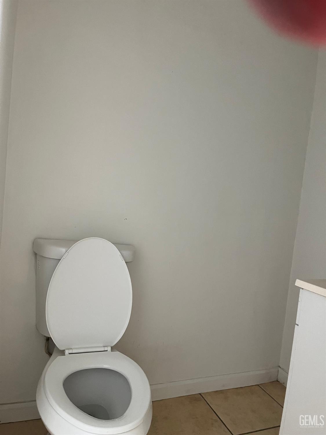 Undisclosed Address Wasco, CA 93280 - Photo 6 of 17 a white toilet sitting next to a white sink and vanity