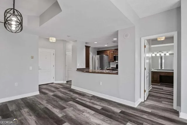 a view of a bedroom with a bed and cabinets