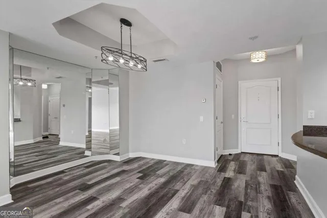a view of a balcony with two chairs and a table