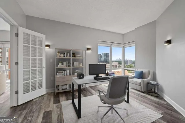 a kitchen with a sink appliances and cabinets