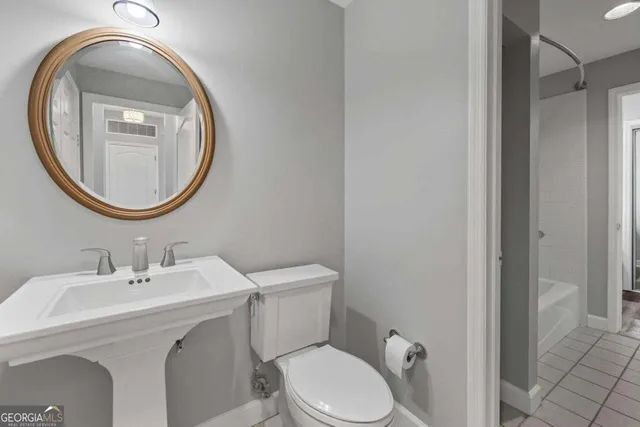 a bathroom with a sink vanity and mirror