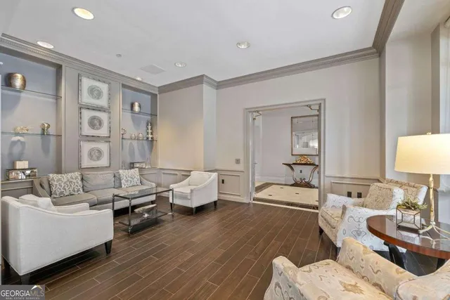 a kitchen with stainless steel appliances granite countertop white cabinets and sink