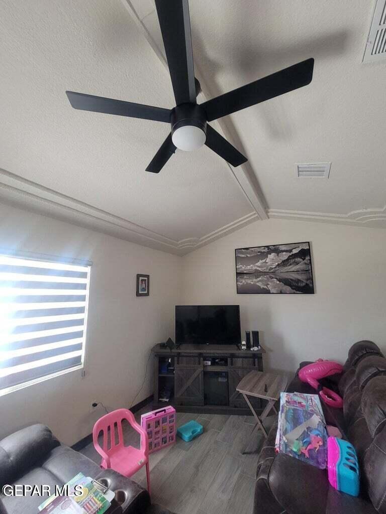 11531 Ernest Road Socorro, TX 79927 - Photo 2 of 36 a living room with furniture and a flat screen tv