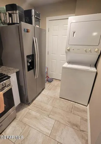 a kitchen with a stove and a refrigerator